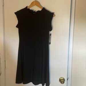Cute black dress with ruffle neck and capped sleeves. NWT 🖤